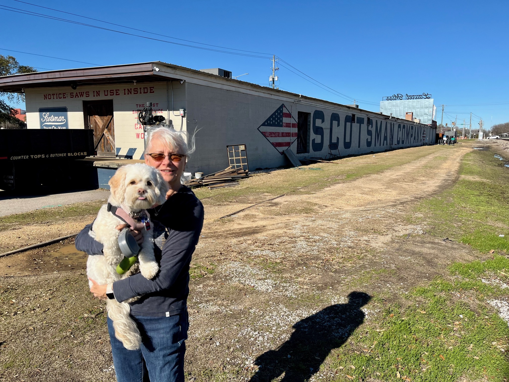 Next to railroad tracks.
